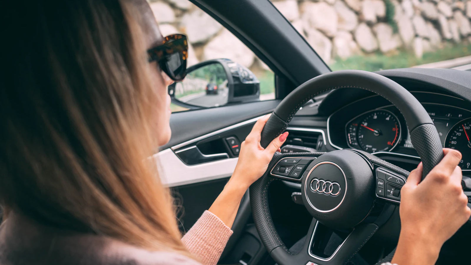 Young woman driving car